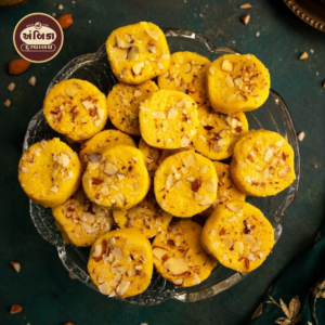 Special Kesar Peda Ahmedabad topped with premium almond flakes, handcrafted with pure saffron, rich milk, and traditional recipes