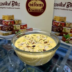 Kesar Pista Basundi topped with saffron and pistachios in Ahmedabad