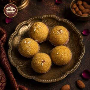 Traditional Magas Laddu Ahmedabad made with roasted gram flour, pure ghee, and premium almonds, handcrafted for an authentic Gujarati sweet experience