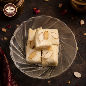 Premium Malai Barfi Ahmedabad made with rich milk, creamy khoya, and topped with sliced almonds, handcrafted for an authentic traditional sweet experience