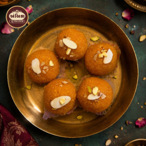 Traditional Motichur Laddu Ahmedabad made with pure ghee, fine boondi, and topped with premium almonds and pistachios for an authentic festive sweet
