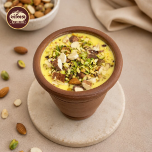 Rajwadi Dryfruit Matka Ahmedabad made with creamy saffron milk and loaded with premium almonds, pistachios, and mixed dry fruits, served in a traditional clay matka