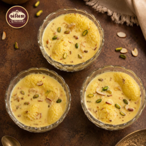 Fresh Ras Malai Ahmedabad with soft paneer discs in saffron milk, topped with pistachios and almonds, freshly prepared daily